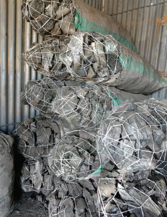 Bagged charcoal stored in a container